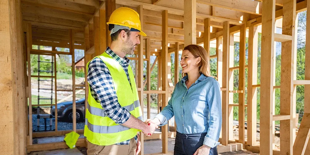 A homeowner (owner-builder) marking a final checklist on their house plans, showing they successfully confirmed local Houston housing codes, engineering, and HOA rules before starting construction.